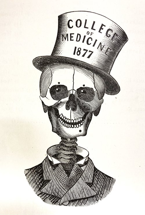 An engraving of a smiling skeleton wearing a suit and top hat. On his hat is written “College of Medicine 1877.”
