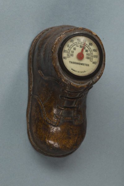 Boot figurine with thermometer inside.