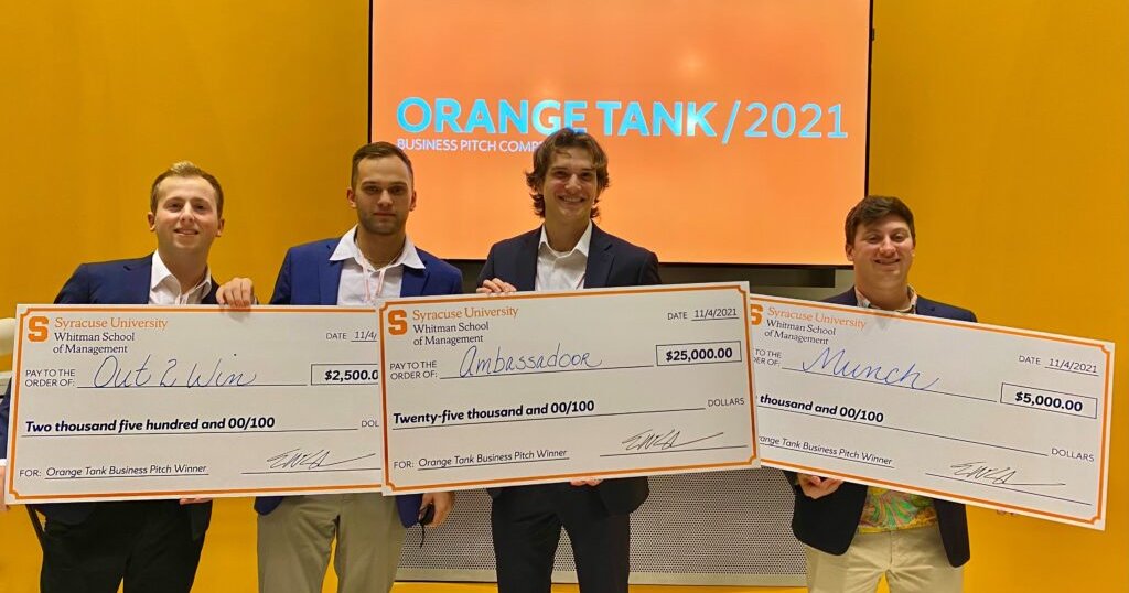 2021 Orange Tank winners each hold an oversized check
