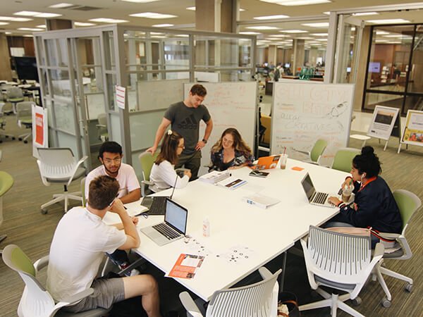 Students working around table in LaunchPad in Bird Library