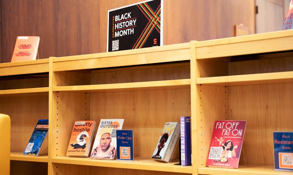 blue background with orange geometric border and text "Celebrating Black History Month 2024"