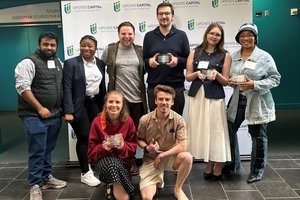 In the back left to right:   Anja Padwal, Tosin Alabi, Jonathan "J" Wess, Jack Venerus, Lindy Truitt and student from University of Buffalo. In the front left to right:  Carolyn Fernandes and Tony Goncalves
