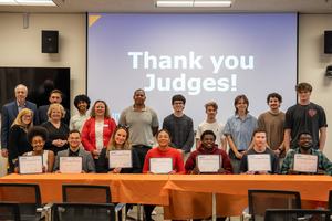 2026 Ideas Fest Judges (back row) and Winners (front row holding certificates)