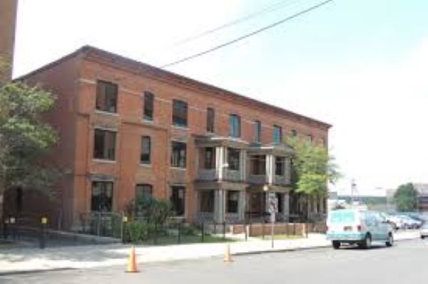 three story red brick building