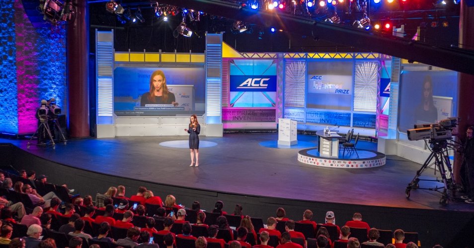 a woman speaking on stage at ACC InVenture Prize