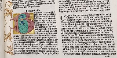 A close-up of a Renaissance edition of the works of Bernard of Clairvaux, featuring the only illumination in the copy. Rare books.
