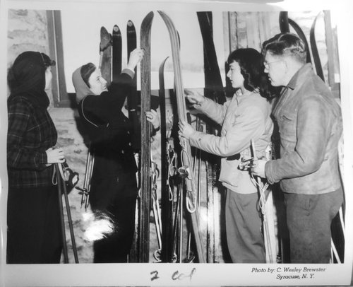 A group of skiers preparing for the slopes. Syracuse University Photograph Collection.