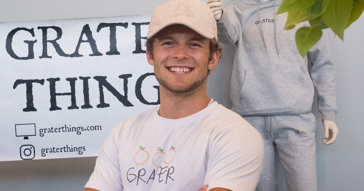 Aidan Turner smiles for a photo at Grater Things pop-up
