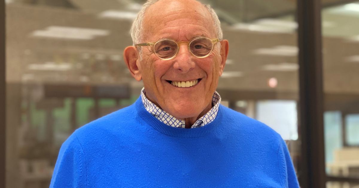 man wearing glasses and blue sweater