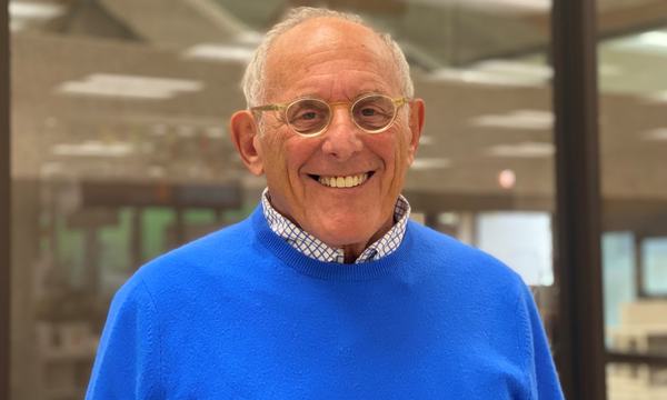 man wearing glasses and blue sweater