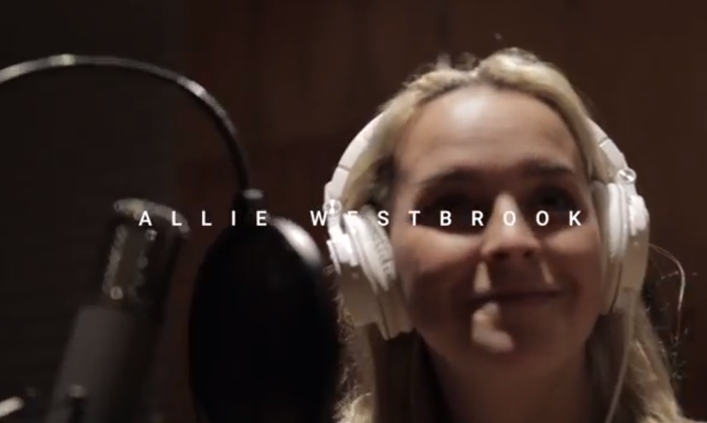 a woman in headphone singing