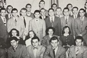 Black and white group photograph showing 30 students arranged into 4 rows. All the students are men, apart from four women seated in the center of the second row.