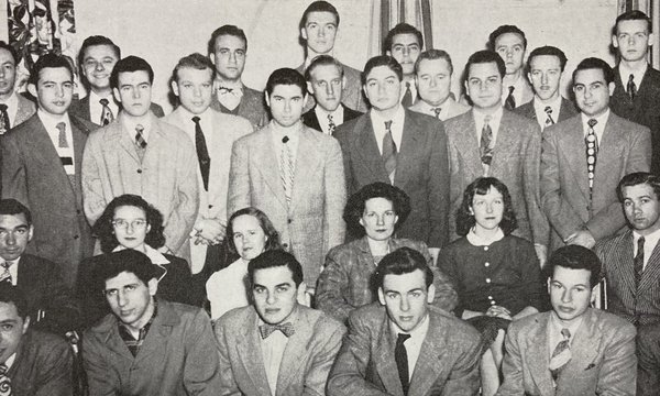 Black and white group photograph showing 30 students arranged into 4 rows. All the students are men, apart from four women seated in the center of the second row.