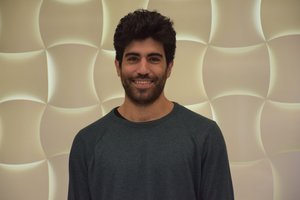 man in front of lightbox