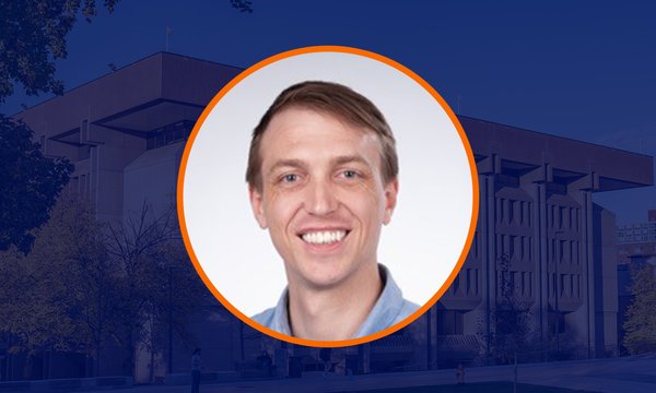 Circular portrait of Andrew Ridgeway with orange outline over dark blue overlaid image of Bird Library