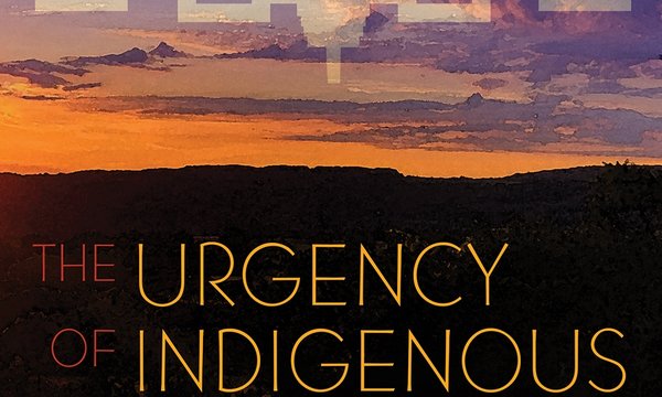 colorful sky with Haudenosaunee symbol across sky