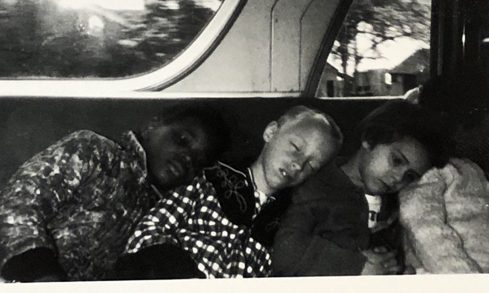 As part of an education initiative, Crusade for Opportunity regularly offered field trips for children in Syracuse neighborhoods. Here are four children sleeping on a bus after a CFO field trip to a local farm.