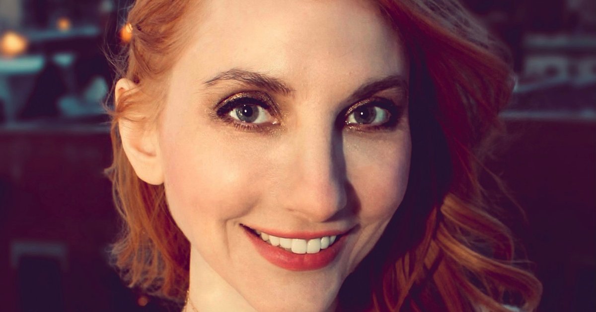 headshot of a woman smiling at the camera