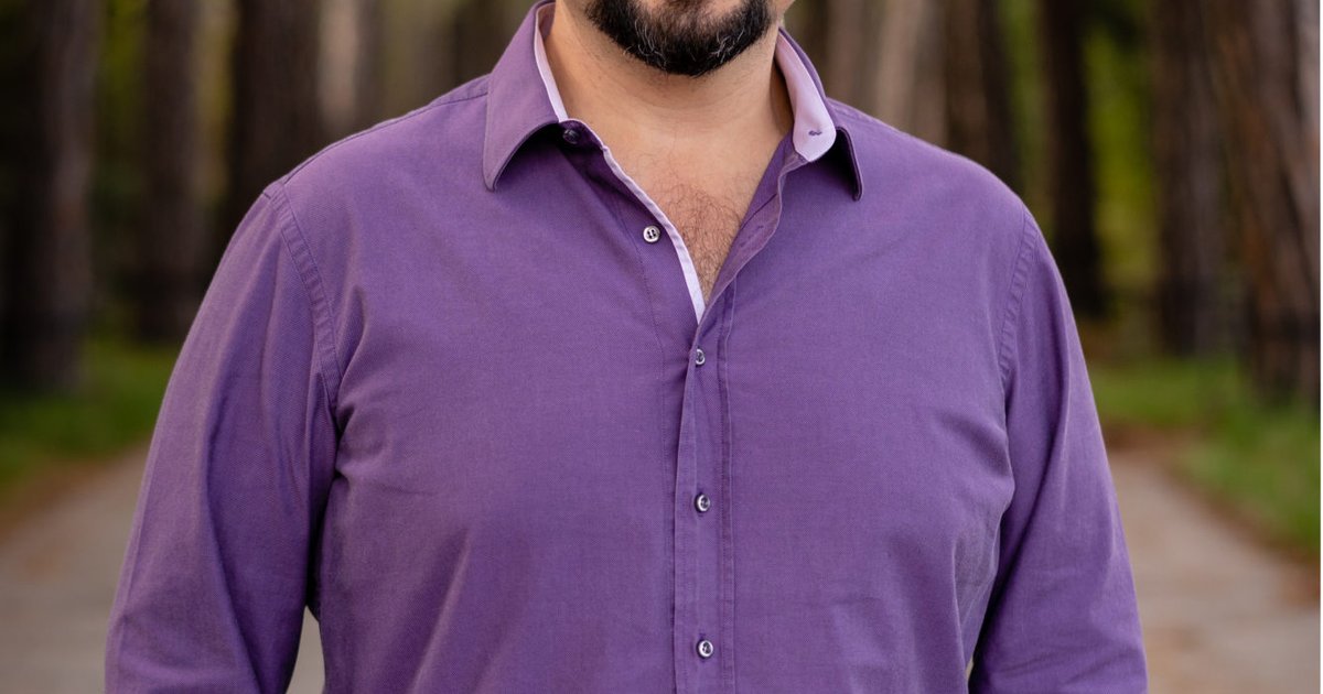 man in purple shirt