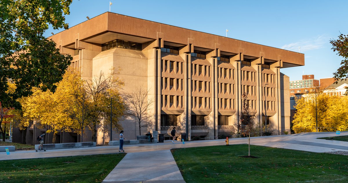 Bird Library and sidewalk at sunset surrounded by trees