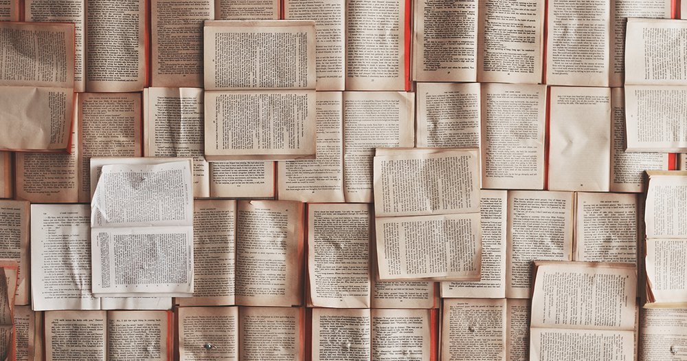 Books in a collage arrangement on a wall