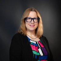 headshot of  Brenna Helmstutler