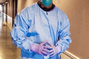 person wearing mask and PPE