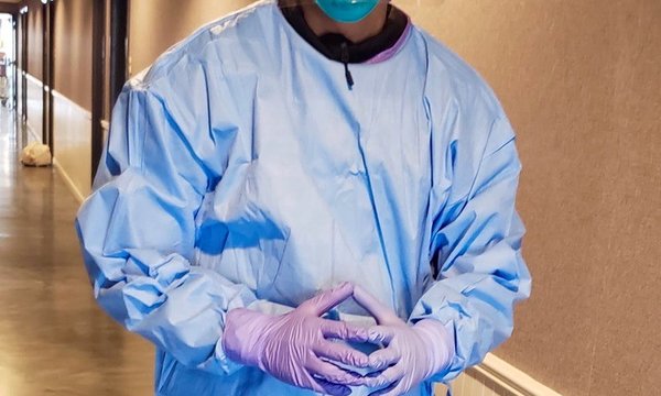 person wearing mask and PPE