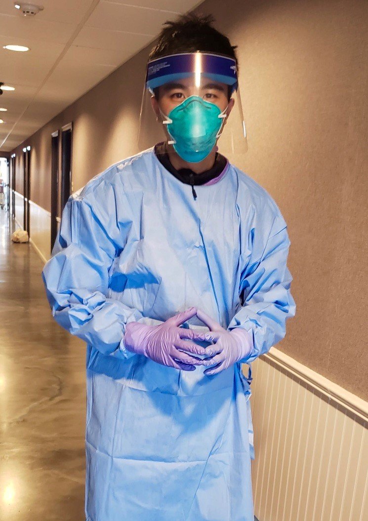 person wearing mask and PPE