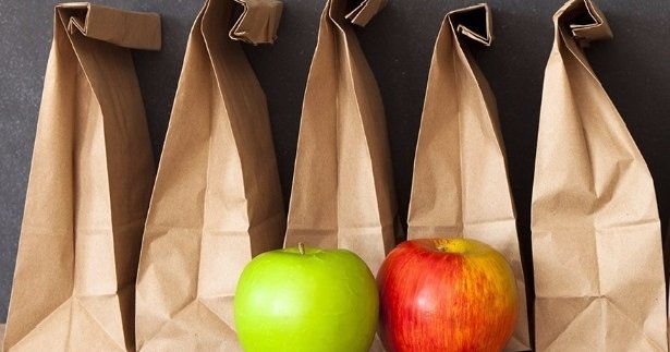 five brown bags and two apples