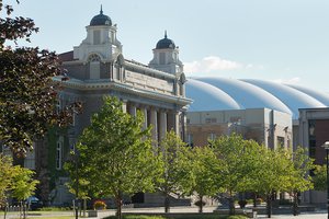Carnegie Library and Carrier Dome during summer surrounded by green trees
