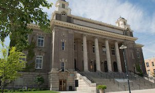 outside of building with four columns in front