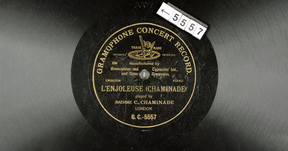 Black L’Enjoleuse (GC-5557) record with gold writing
