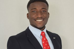 person in a suit looking at the camera