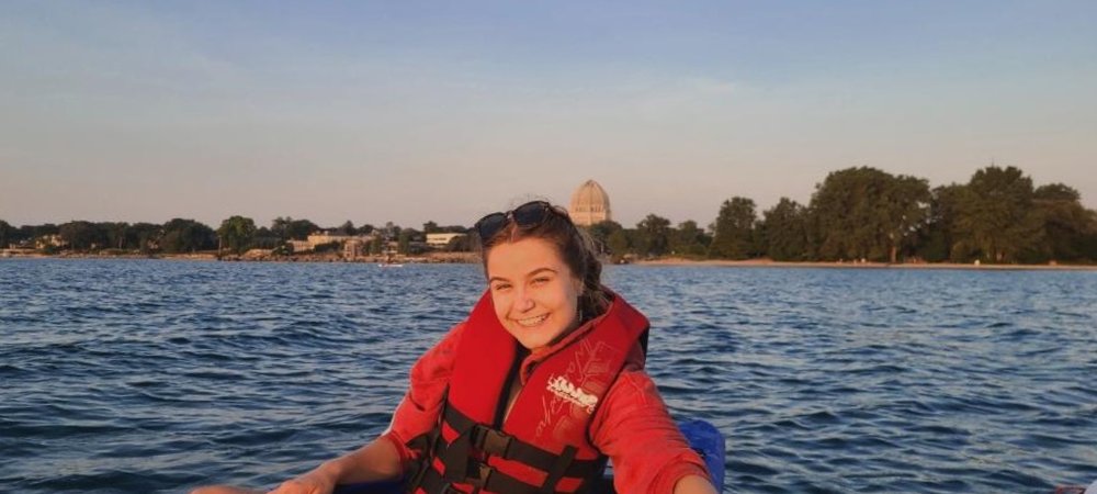student in a life vest on a canal in Venice