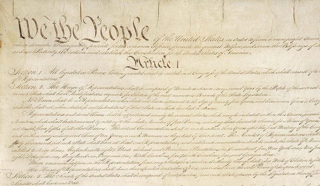 Close up of the United States Constitution page 1, starting with "We the People" and Article 1