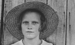 Lucille Burroughs, daughter of cotton sharecropper, wearing straw hat