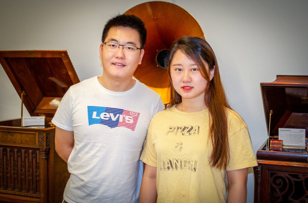 Two graduate students standing together in Belfer Audio Archives