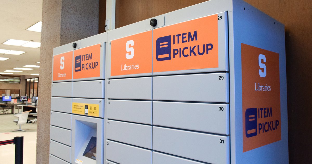 Gray lockers with orange signs that read "Item Pickup" and Syracuse University Libraries logo with touch screen in the middle