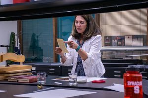 Marianne Hanley, Preservation Librarian, providing book repair instruction in the Preservation Lab.