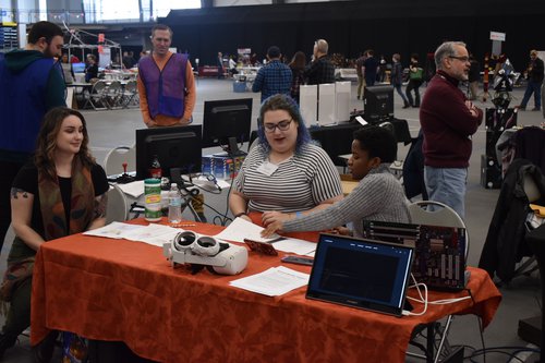 ibrarian Natalie LoRusso and iSchool graduate students Chloe Guedalia and Rachel Hogan manning Libraries&#x27; table at Maker Faire 2022.