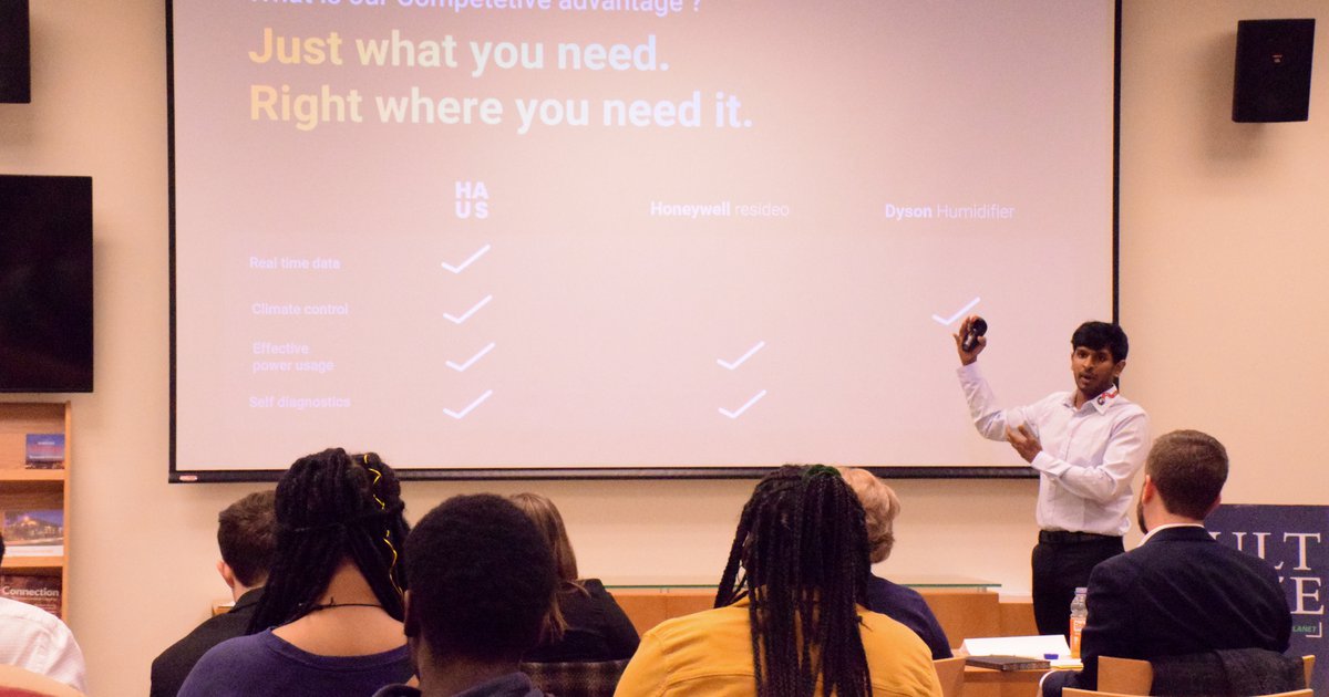 Student presenting a startup pitch slide deck at the 2019 Hult Prize Blackstone LaunchPad at Syracuse University competition