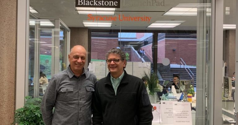 Dennis Taussig and Tom Nerviano smile for a photo