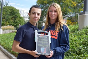 EmergiCan co-founders with prototype