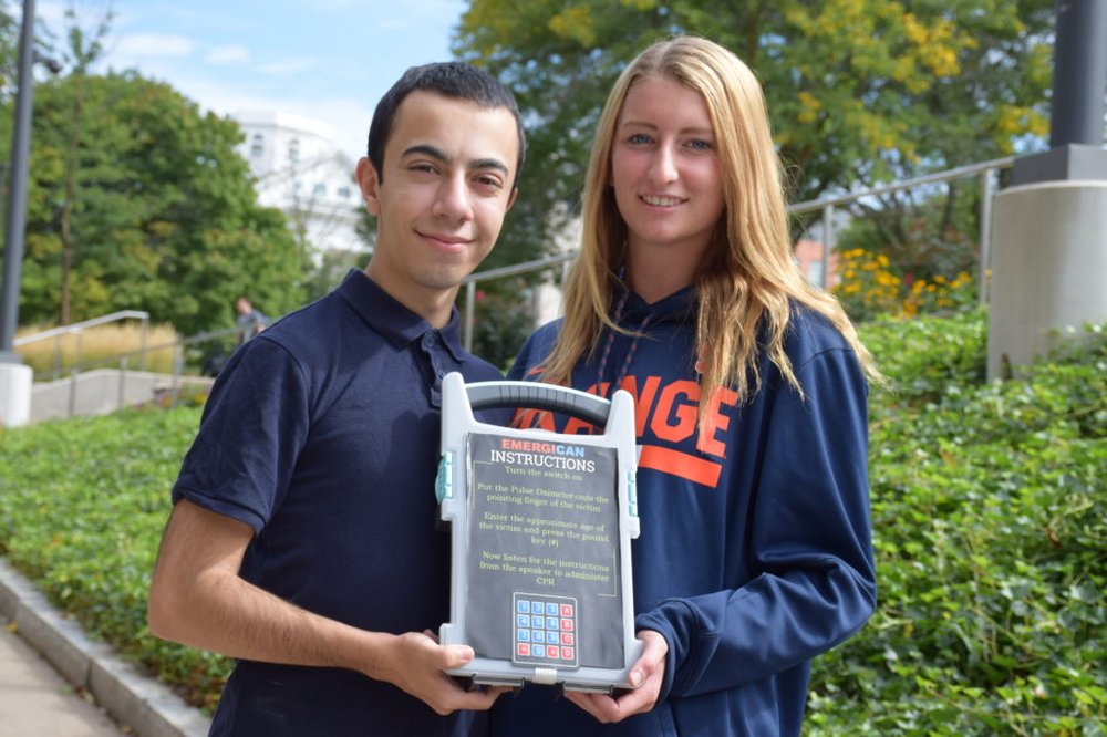 EmergiCan co-founders with prototype