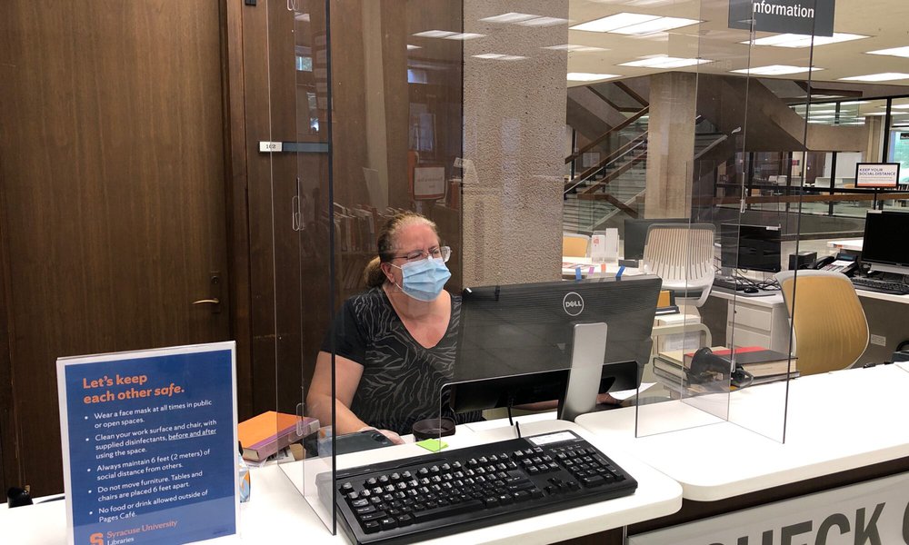 Employee at check out desk