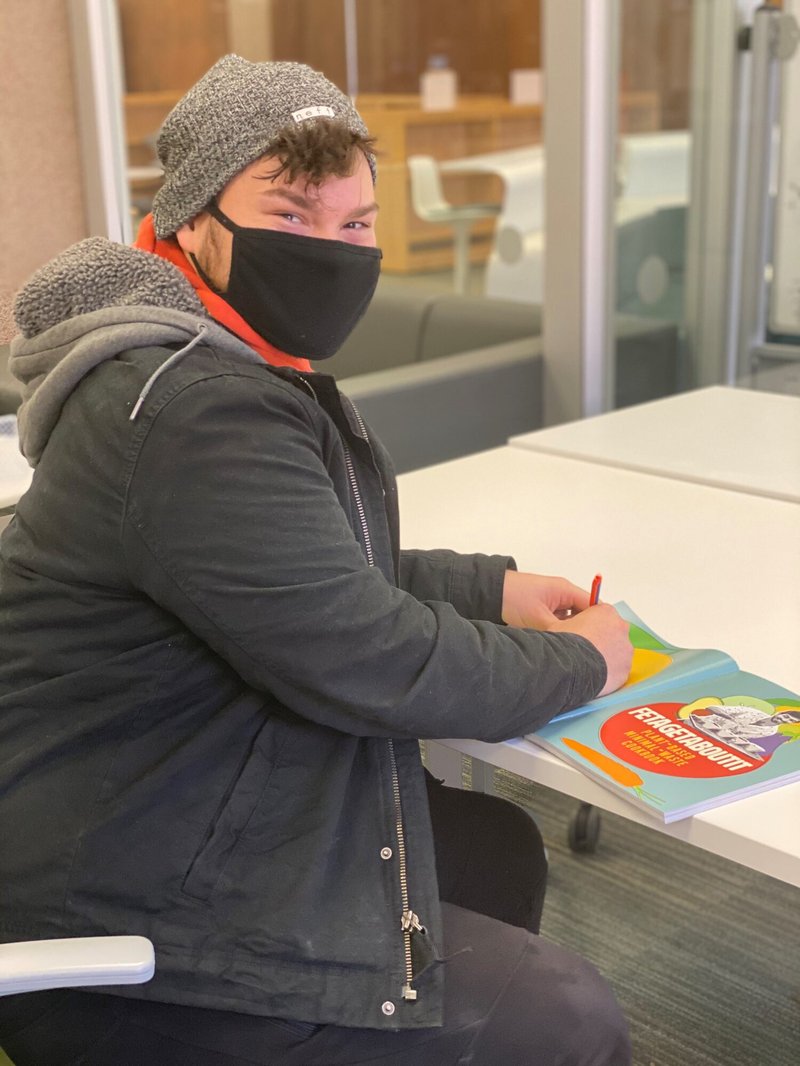 Ethan-Tyo-autographing-his-book
