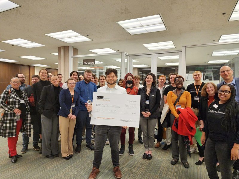 Ethan Tyo with oversized check