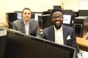 two students in a computer lab