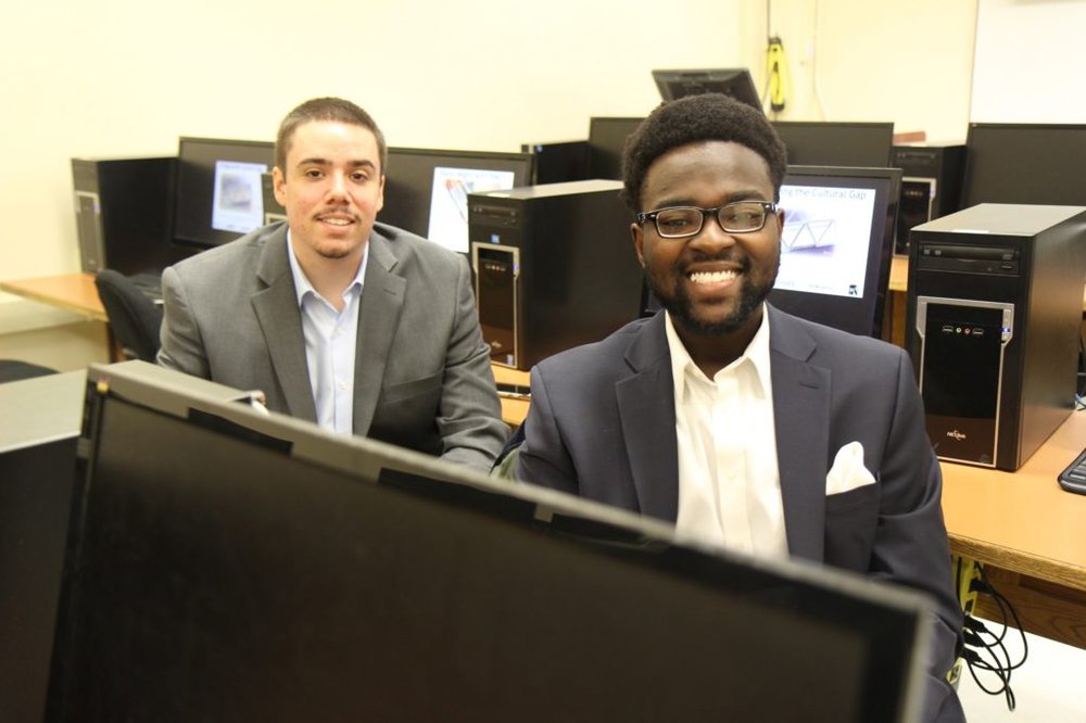 two students in a computer lab